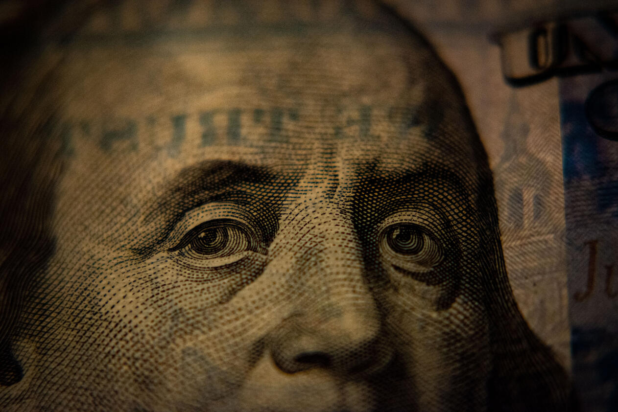 Benjamin Franklin on the $100 bill closeup and moody tone. Benjamin Franklin eyeballs.